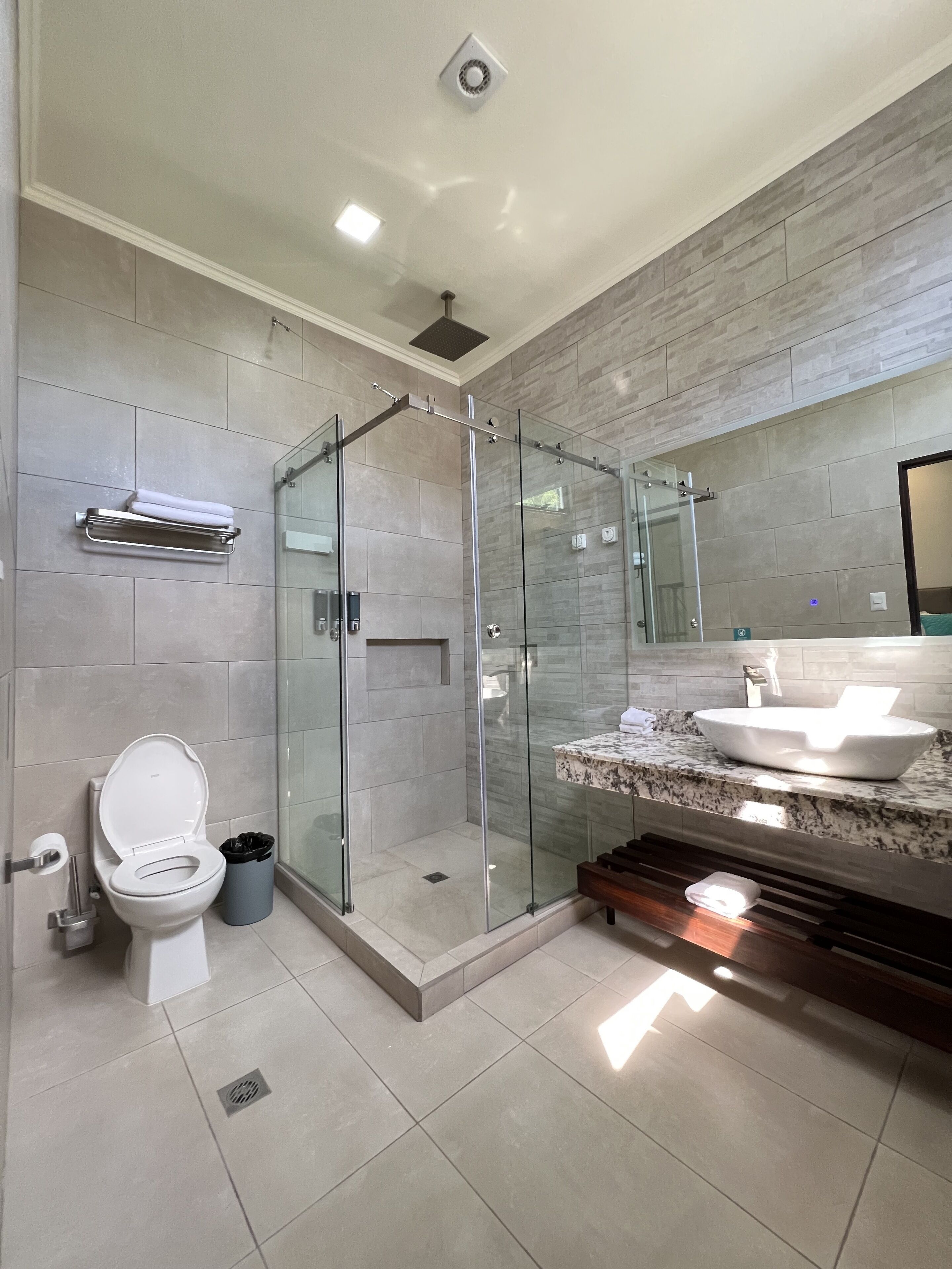 premium quadruple room (naoz) | bathroom | shower, rainfall showerhead, hair dryer, towels