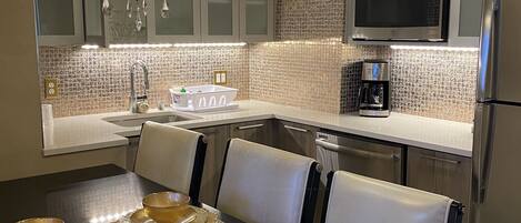 Fridge, microwave, coffee/tea maker, dining tables