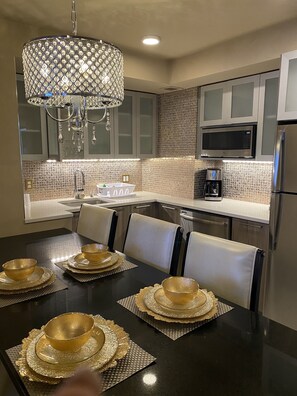 Fridge, microwave, coffee/tea maker, dining tables