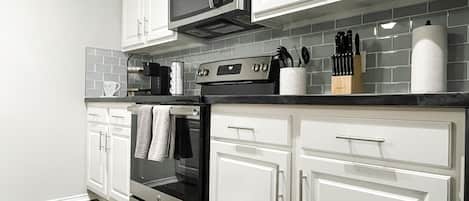 Dishwasher, coffee/tea maker, cookware/dishes/utensils