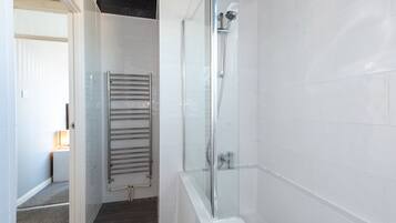 Combined shower/bathtub, hair dryer, towels, soap