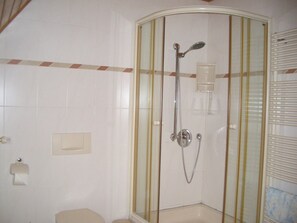 Bathtub, hair dryer, towels, soap