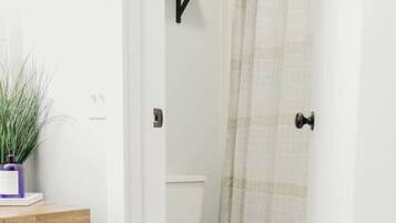 Combined shower/bathtub, hair dryer, towels, soap
