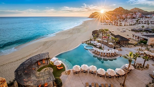 A resort with a pool, beach, and mountain views. - Sweeping ocean view Luxury Penthouse 2 Bedrooms (Cabo San Lucas)