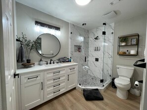 Combined shower/tub, hair dryer, towels, soap