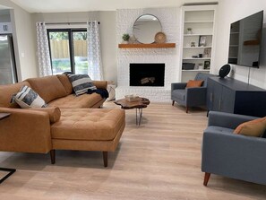 Smart TV, fireplace, books