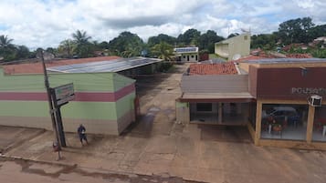 Stroll through the urban streets of this commercial area, lined with buildings featuring flat roofs and satellite dishes.