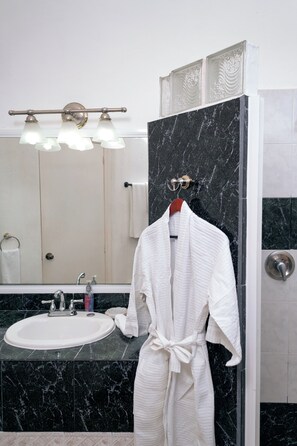 Shower, hair dryer, towels, soap