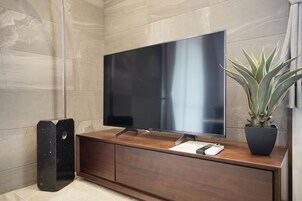 Design Apartment, 2 Bedrooms, Non Smoking | Living area | 49-inch LCD TV with digital channels, TV