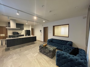 Design Apartment, 2 Bedrooms, Non Smoking | Living area | 49-inch LCD TV with digital channels, TV