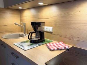 Fridge, microwave, stovetop, coffee/tea maker