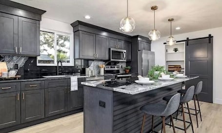 Fridge, microwave, oven, stovetop. Mid Century Modern + 5min to Downtown + Walk to River + Hot Tub + Dog Friendly