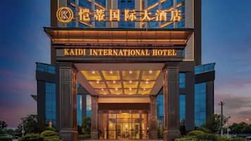 The Kaidi International Hotel entrance with a modern design and illuminated signage.