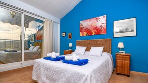 A hotel room with a large bed, a balcony, and artwork on the walls. - Tigre - Jesus Pobre, Costa Blanca (Jesus Pobre)