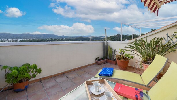 A terrace with a view of distant mountains, potted plants, and outdoor furniture. - Tigre - Jesus Pobre, Costa Blanca (Jesus Pobre)