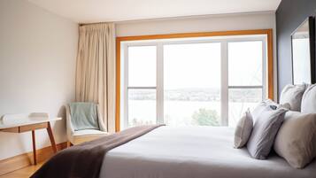 Comfort Condo | Individually furnished, blackout drapes, free WiFi, bed sheets