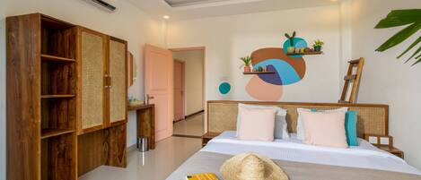 A bedroom with a bed, wooden wardrobe, and a wall-mounted shelf with plants.