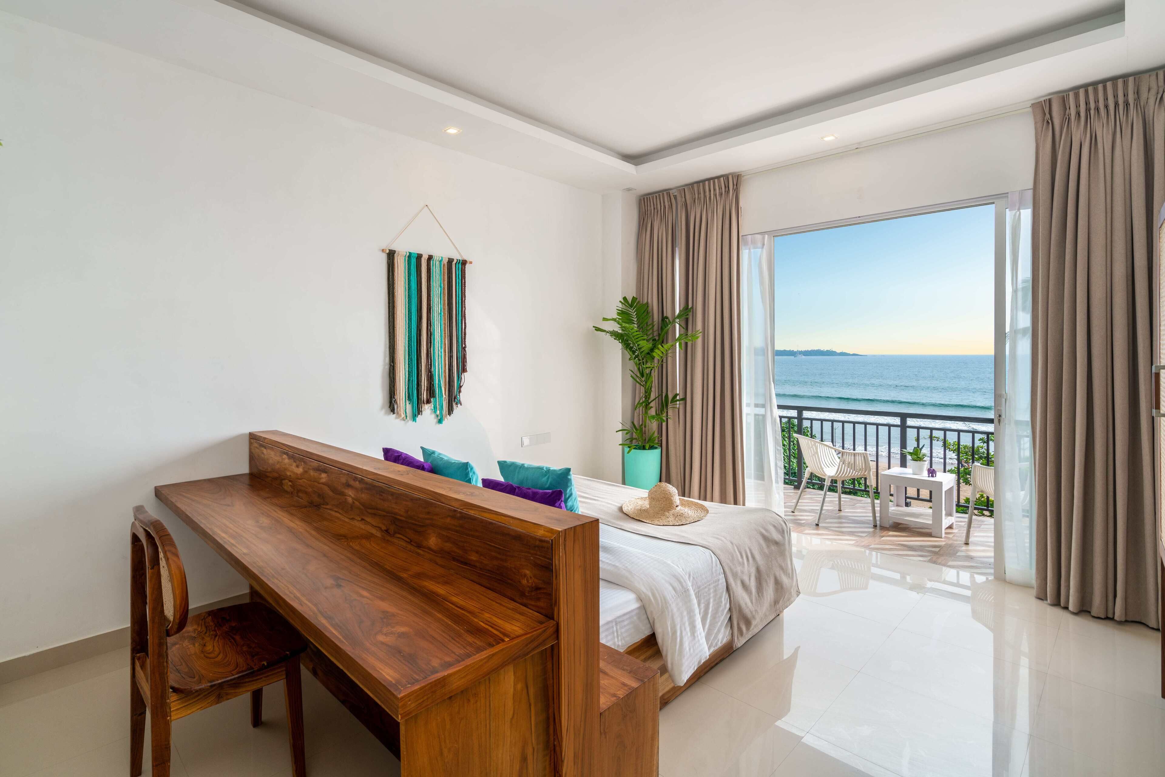 Deluxe Double Room, Oceanfront | Desk, laptop workspace, WiFi (surcharge), bed sheets