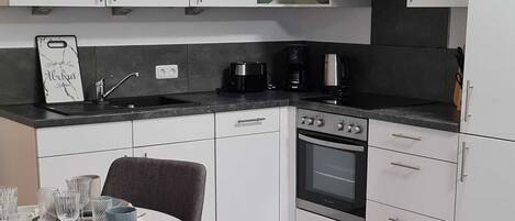 Fridge, oven, dishwasher, high chair