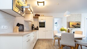 Coffee/tea maker, fridge, microwave, oven