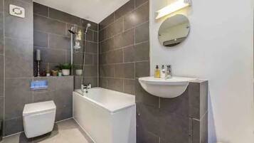 Combined shower/tub, hair dryer, towels, soap