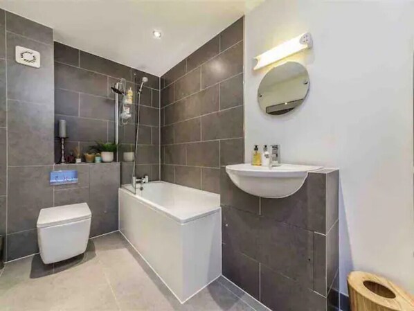 Combined shower/tub, hair dryer, towels, soap