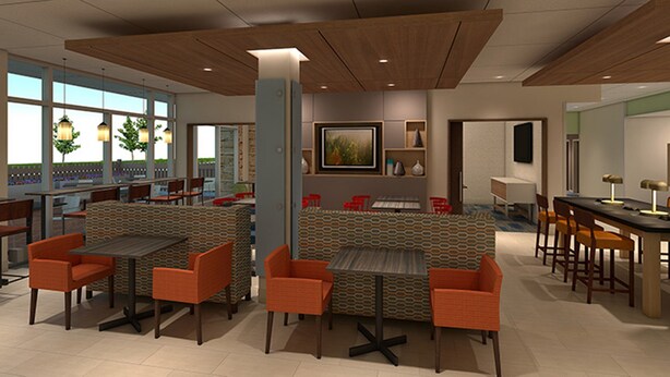 A modern restaurant with high tables and orange chairs, a large window with a view, and a wooden ceiling.