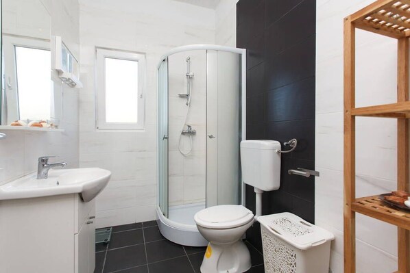 Shower, hair dryer, towels, soap