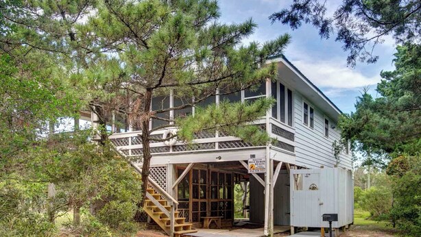 A two-story house with a balcony, wooden deck, and a mailbox. - Cole Bin - Ocracoke Island (Ocracoke)