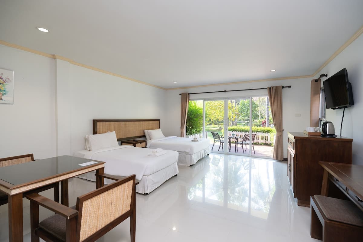 Deluxe Room, Garden View | 1 bedroom, individually decorated, individually furnished, desk
