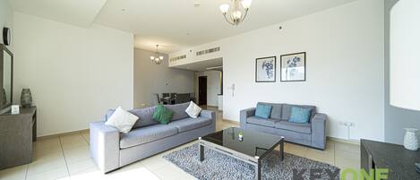 Luxury Apartment | Living area | 43-inch Smart TV with cable channels, TV