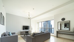 Luxury Apartment | Living area | 43-inch Smart TV with cable channels, TV - KOHH – 2BR in Rimal (Dubai)