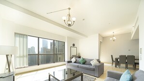 Luxury Apartment | Living area | 43-inch Smart TV with cable channels, TV - KOHH – 2BR in Rimal (Dubai)