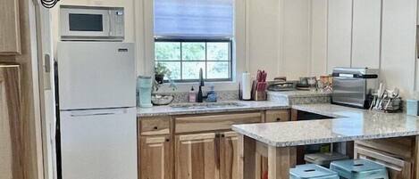 Fridge, microwave, coffee/tea maker, toaster