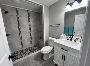 Combined shower/bathtub, towels, soap, toilet paper - Raleigh 3BR Home with EV Charger & Game Arcade (Wake County)