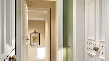 A hallway with a sign reading "310 Caravella" and a door labeled "309 Trion."
