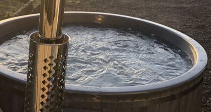 Farm setting with large living areas and wood fired hot tub