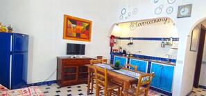 Fridge, stovetop, cookware/dishes/utensils, dining tables