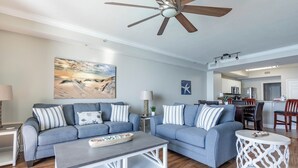 A modern living room with two sofas, a coffee table, and a ceiling fan. - Breathtaking Views in this Tidewater 2 BR  2 BA Slps 8, 19th Floor! NEW OWNER (Panama City Beach)