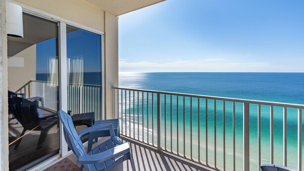 A balcony with a view of the ocean, a sliding glass door, and two chairs. - Breathtaking Views in this Tidewater 2 BR  2 BA Slps 8, 19th Floor! NEW OWNER (Panama City Beach)