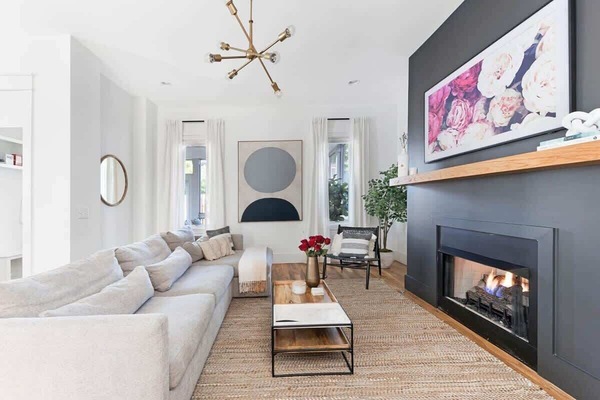 The living room, with its large sectional and side chair, offers plenty of space for everyone to relax and gather.