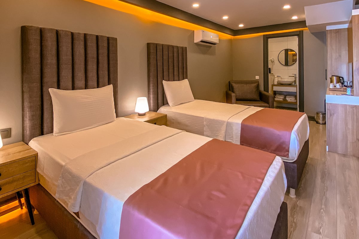 Family Suite, 2 Bedrooms, Non Smoking, Garden View | Premium bedding, free minibar items, individually decorated