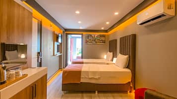Suite Familiale, 2 chambres, non-fumeurs, vue jardin | Literie de qualité supérieure, mini-bar avec articles gratuits
