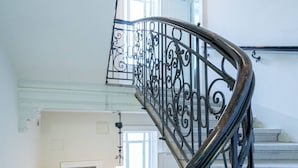 A spiral staircase with ornate metal railings, leading to an upper floor. - Vienna Residence, City Hall - Parliament #6414 (Vienna)