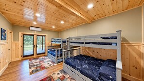 A room with bunk beds, a wooden ceiling, and a large window. - Grand Peaks Lodge, Luxury Log Home, Views, Hot Tub, Sauna, EV Charger, 3D Tour (Jay)
