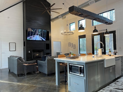 Modern Luxe has everything with HUGE back deck, jacuzzi, glam outdoor fireplace