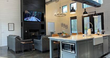 Modern Luxe has everything with HUGE back deck, jacuzzi, glam outdoor fireplace