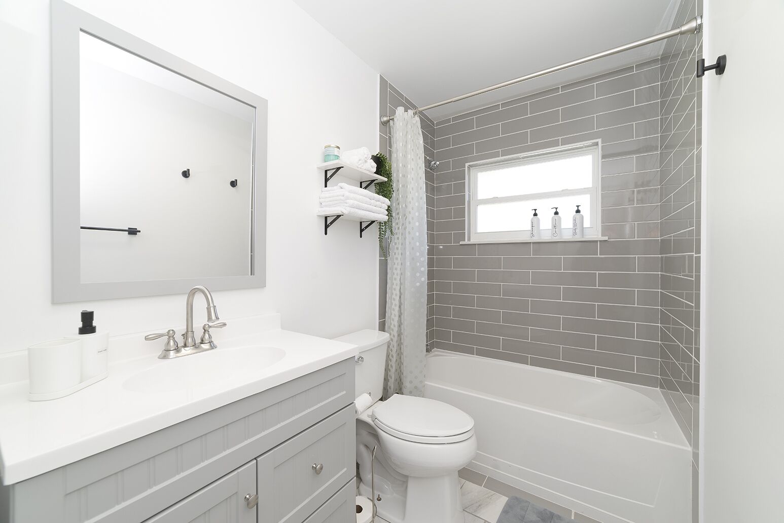 Combined shower/tub, hair dryer, towels, soap