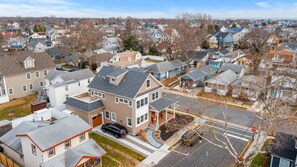 Stroll through a charming suburban neighborhood with well-maintained homes and a peaceful atmosphere.