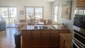 Enjoy cooking in this well-equipped kitchen with a central island, stovetop, and oven.